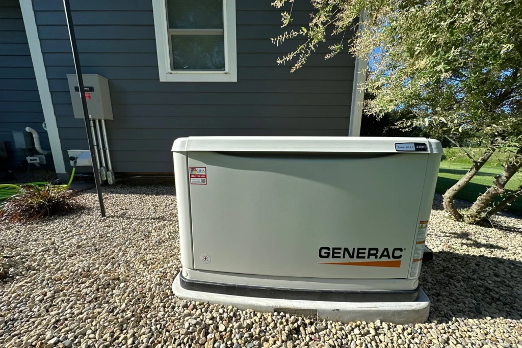 Generac standby generator with a GSHA Services label installed beside a home