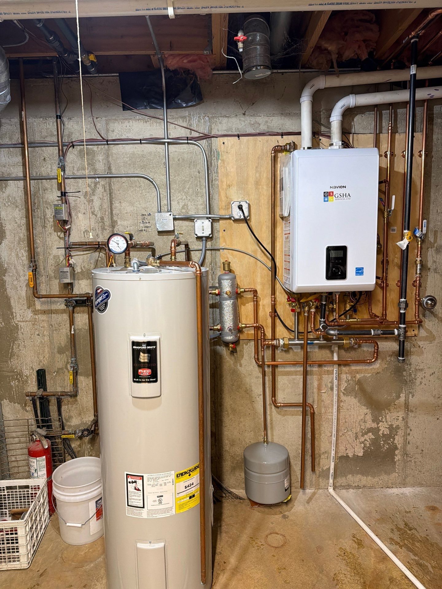 Navien NCB-240/110H combi-boiler with PVC venting and expansion tank in a Woodstock, IL basement