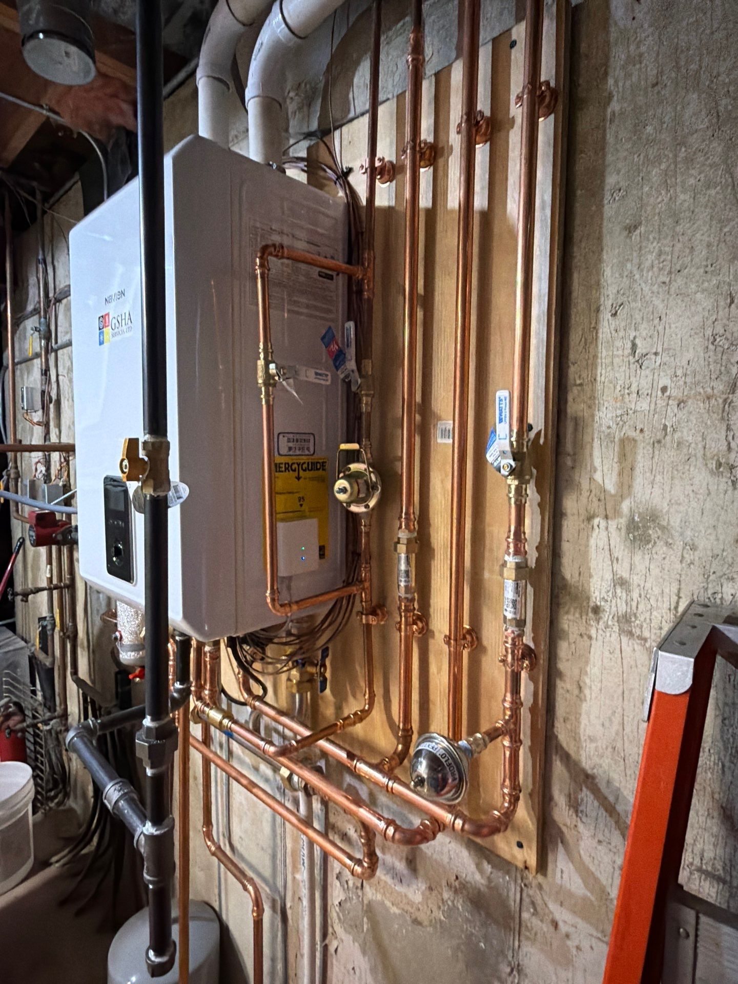 Copper supply and return piping on a Navien NCB-240/110H combi-boiler installed by GSHA Services